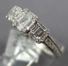 ESTATE .64CT DIAMOND 18KT WHITE GOLD ROUND & BAGUETTE INVISIBLE SQUARE LOVE RING
