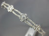 ESTATE WIDE 1.24CT DIAMOND 18KT WHITE GOLD ROUND INFINITY FLOWER BANGLE BRACELET