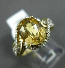 ESTATE 3.09CT DIAMOND & EXTRA FACET YELLOW TOPAZ 14KT YELLOW GOLD INFINITY RING