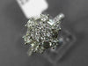 WIDE .89CT ROUND & BAGUETTE DIAMOND 18KT WHITE GOLD OCTAGON FLOWER CLUSTER RING