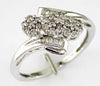 ESTATE .33CT DIAMOND 14KT WHITE GOLD ROUND & BAGUETTE 3 FLOWER CRISS CROSS RING