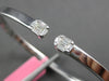 WIDE .30CT DIAMOND 18KT WHITE GOLD BAGUETTE INVISIBLE FLEXIBLE BANGLE BRACELET