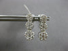 1.0CT DIAMOND 14KT WHITE GOLD 3D MULTI FLOWER JOURNEY SCREWBACK HANGING EARRINGS