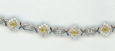 4.87CT WHITE & FANCY YELLOW DIAMOND 18KT 2 TONE GOLD 3D CUSHION & ROUND BRACELET