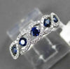 ESTATE .65CT DIAMOND & AAA SAPPHIRE 18KT WHITE GOLD INFINITY ETOILE RING