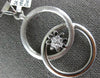 ESTATE LARGE .19CT DIAMOND 18KT WHITE GOLD FLOWER LOVE KNOT CIRCULAR FUN PENDANT