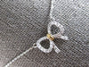 ESTATE SMALL .07CT DIAMOND 14KT WHITE & YELLOW GOLD 3D CLASSIC BOW LOVE NECKLACE