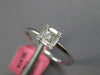 SMALL .18CT DIAMOND 18KT WHITE GOLD ROUND & BAGUETTE CLUSTER INVISIBLE FUN RING