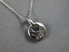 ESTATE .20CT DIAMOND 14KT WHITE GOLD ROUND & BAGUETTE CIRCULAR FLOATING PENDANT