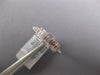 ESTATE .64CT DIAMOND 18KT WHITE GOLD ROUND & BAGUETTE INVISIBLE SQUARE LOVE RING