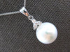 .08CT DIAMOND & SOUTH SEA PEARL 14KT WHITE GOLD FLOWER 3 STONE FLOATING PENDANT