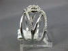 LARGE .65CT DIAMOND 18K WHITE GOLD CLUSTER CRISS CROSS FLOWER HALO INFINITY RING