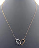 ESTATE .31CT DIAMOND 18KT WHITE & ROSE GOLD DOUBLE OPEN OVAL LOVE KNOT PENDANT