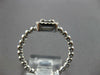 ESTATE .27CT DIAMOND 18KT WHITE GOLD ROUND & BAGUETTE INVISIBLE HALO BEADED RING