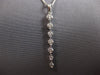 .65CT DIAMOND 18KT WHITE GOLD 3D ROUND SHARED PRONG JOURNEY BAR FLOATING PENDANT