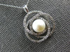 .50CT DIAMOND & AAA SOUTH SEA PEARL 14KT WHITE GOLD LOVE KNOT INFINITY PENDANT