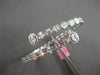 LARGE 5.69CT DIAMOND 18KT WHITE GOLD ROUND & BAGUETTE INVISIBLE BANGLE BRACELET