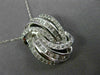 LARGE .75CT ROUND & BAGUETTE DIAMOND 14KT WHITE GOLD LOVE KNOT MULTI ROW PENDANT