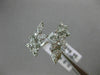 ESTATE WIDE 18KT WHITE GOLD LOVE RING. 3D MULTI LEAF CRISS CROSS DESIGN