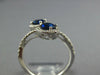 WIDE 1.23CT DIAMOND & AAA SAPPHIRE 18KT WHITE GOLD OVAL & ROUND CRISS CROSS RING