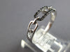 ESTATE .09CT WHITE & BLACK DIAMOND 14KT WHITE GOLD 3D OVAL LOVE KNOT FUN RING