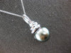 LARGE .07CT DIAMOND & AAA TAHITIAN PEARL 14KT WHITE GOLD SWIRL FLOATING PENDANT