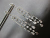 LONG 1.25CT DIAMOND 14KT WHITE GOLD ROUND & BAGUETTE HORSESHOE HANGING EARRINGS