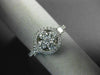 ESTATE .82CT DIAMOND 18K WHITE GOLD 3D ROUND & PRINCESS 4 STONE FLOWER HALO RING