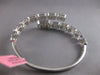 EXTRA LARGE 6.07CT DIAMOND 18KT WHITE GOLD ROUND & BAGUETTE 3D BANGLE BRACELET