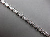 ESTATE 1CT DIAMOND 14KT WHITE GOLD 3D CLASSIC ROUND BEZEL ETOILE TENNIS BRACELET