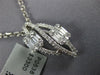 .73CT DIAMOND 18KT WHITE GOLD ROUND & BAGUETTE DOUBLE LEAF INFINITY LOVE PENDANT
