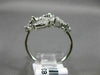 ESTATE WIDE 18KT WHITE GOLD LOVE RING. 3D MULTI LEAF CRISS CROSS DESIGN