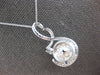LARGE .36CT DIAMOND & SOUTH SEA PEARL 18KT WHITE GOLD LOVE KNOT FLOATING PENDANT