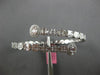 LARGE 5.69CT DIAMOND 18KT WHITE GOLD ROUND & BAGUETTE INVISIBLE BANGLE BRACELET