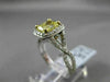 ESTATE 1.82CTW GIA FANCY YELLOW DIAMOND 18KT WHITE GOLD HALO ENGAGEMENT RING