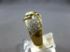 1.20CT DIAMOND & AAA SAPPHIRE 18KT YELLOW GOLD ROUND & BAGUETTE CRISS CROSS RING