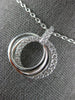 ESTATE .55CT DIAMOND 18KT WHITE GOLD CIRCLE OF LIFE INTERTWINING TRINITY PENDANT