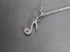 ESTATE .06CT DIAMOND 14KT WHITE GOLD CLASSIC MUSICAL NOTE FUN FLOATING PENDANT