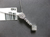 .50CT DIAMOND 14KT WHITE GOLD ROUND & PRINCESS INVISIBLE FLOWER FLOATING PENDANT