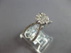 ESTATE LARGE .64CT DIAMOND 14KT WHITE GOLD FLOWER CRISS CROSS INFINITY LOVE RING