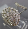 ESTATE LARGE 1.47CT ROUND DIAMOND 14KT WHITE GOLD OVAL OPEN CLUSTER TENSION RING