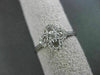 ANTIQUE SMALL .16CT DIAMOND 14KT WHITE GOLD FLORAL FOUR PETAL PAVE CLUSTER RING