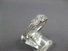 ESTATE .64CT DIAMOND 18KT WHITE GOLD ROUND & BAGUETTE INVISIBLE SQUARE LOVE RING