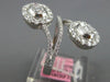 LARGE 1.06CT DIAMOND 18K WHITE GOLD ROUND & BAGUETTE INVISIBLE CRISS CROSS RING