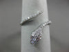 ESTATE .27CT DIAMOND & AAA RUBY 18KT WHITE GOLD 3D CRISS CROSS SNAKE FUN RING