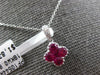 SMALL .78CT DIAMOND & AAA RUBY 18KT WHITE GOLD INVISIBLE 4 LEAF CLOVER PENDANT
