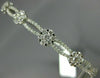 1.24CT DIAMOND 18KT WHITE GOLD 3D FLOWER CLUSTER SEMI ETERNITY BANGLE BRACELET