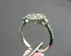ESTATE .82CT DIAMOND 18K WHITE GOLD 3D ROUND & PRINCESS 4 STONE FLOWER HALO RING
