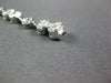 3.98CT DIAMOND 18KT WHITE GOLD INVISIBLE FLOWER OVAL BY THE YARD TENNIS BRACELET