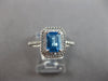 1.44CT DIAMOND & AAA BLUE TOPAZ 14KT WHITE GOLD 3D EMERALD CUT & ROUND HALO RING